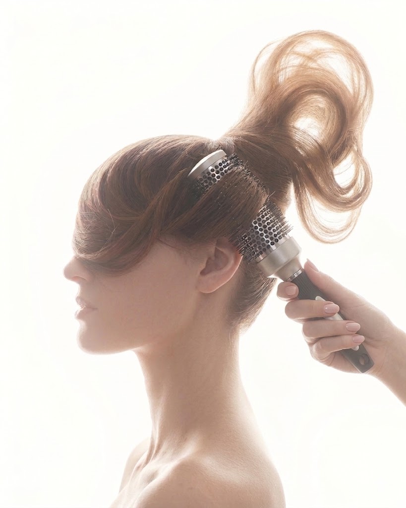 Woman with styled hair being brushed